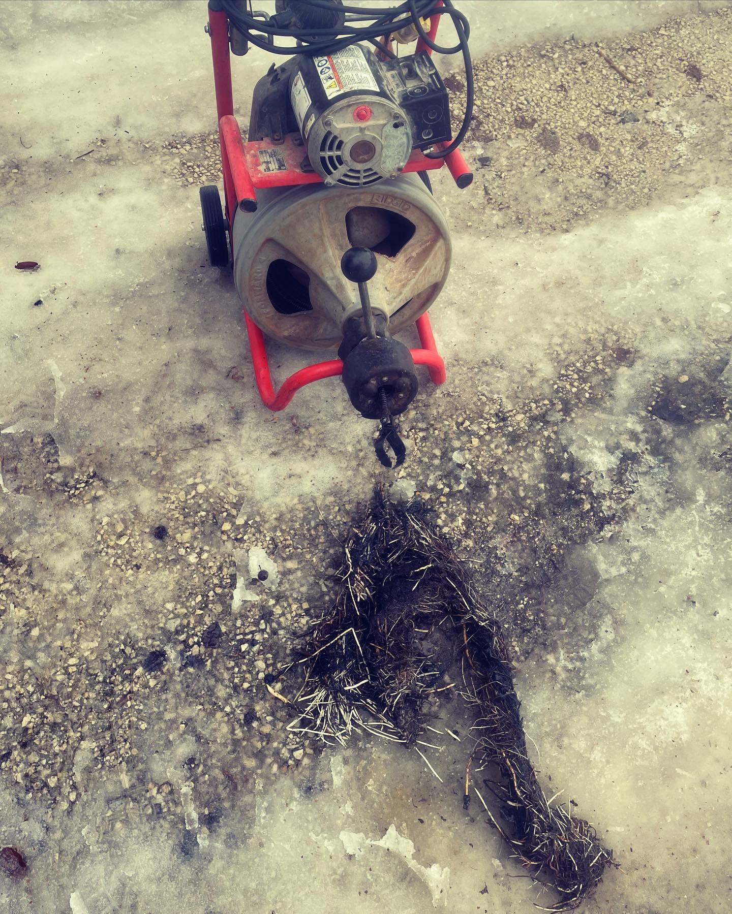 Professional drain cleaning machine with roots and debris