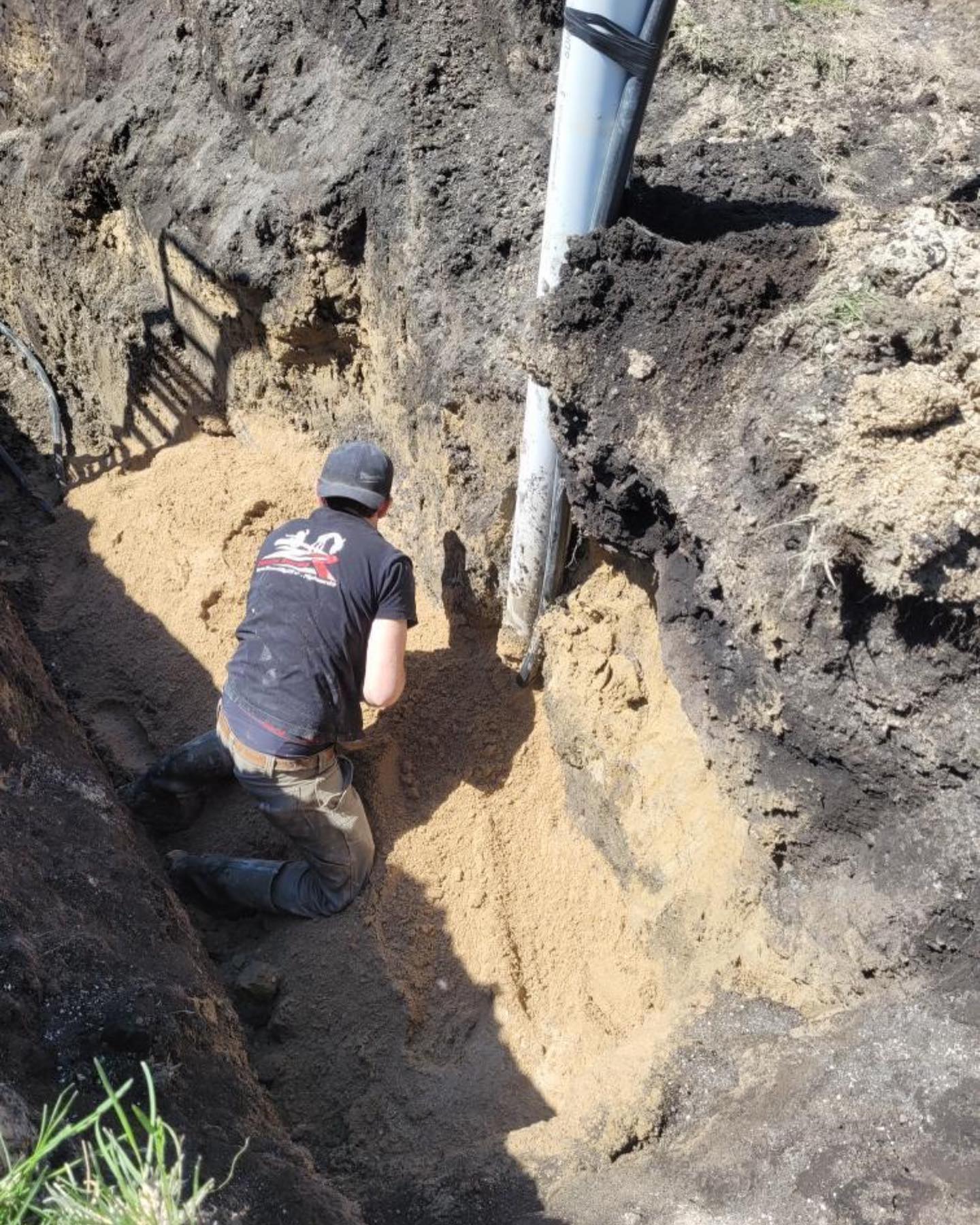 Submersible well pump installation with pitless adapter